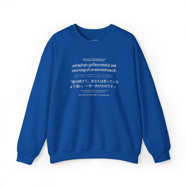 Blue Keep Going sweatshirt with motivational multilingual text, classic fit, cotton-polyester blend, tear-away label