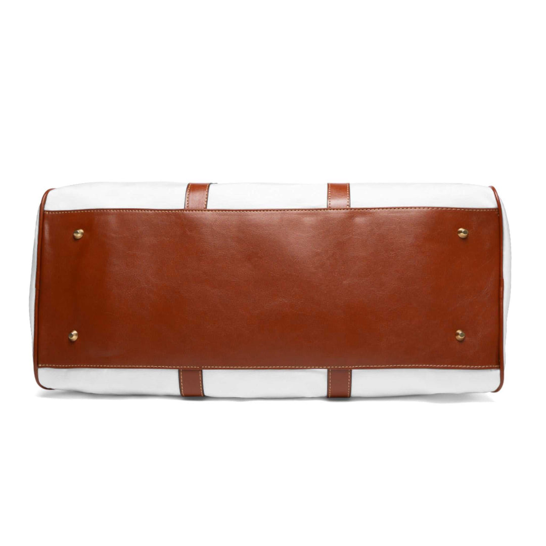 Bottom view of Jesus is King travel bag with brown PU leather base and gold-colored metal feet