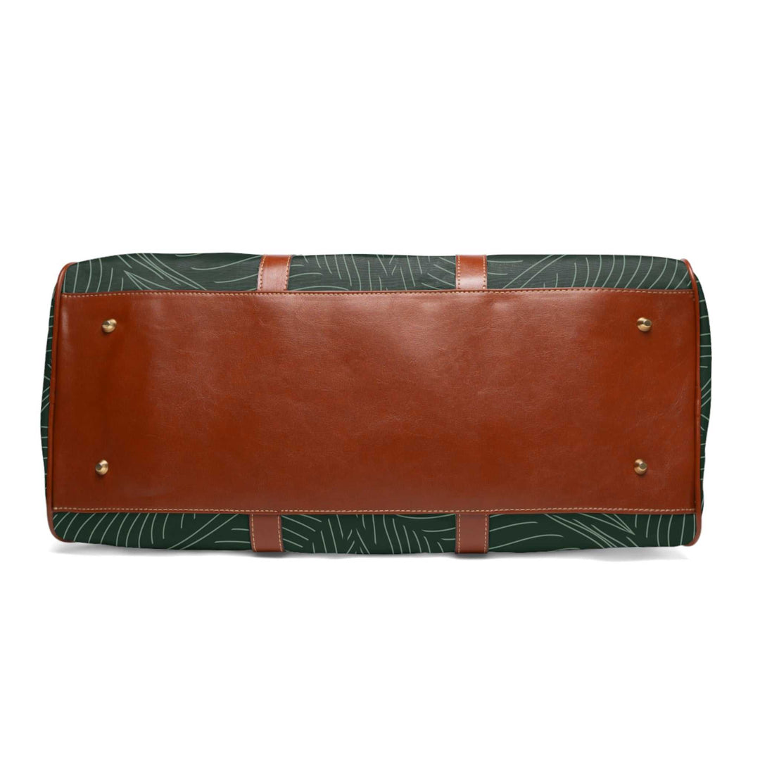 Bottom view of tropical travel bag with brown PU leather base