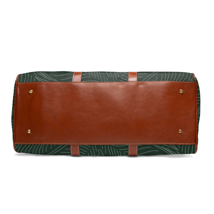 Bottom view of tropical travel bag with brown PU leather base