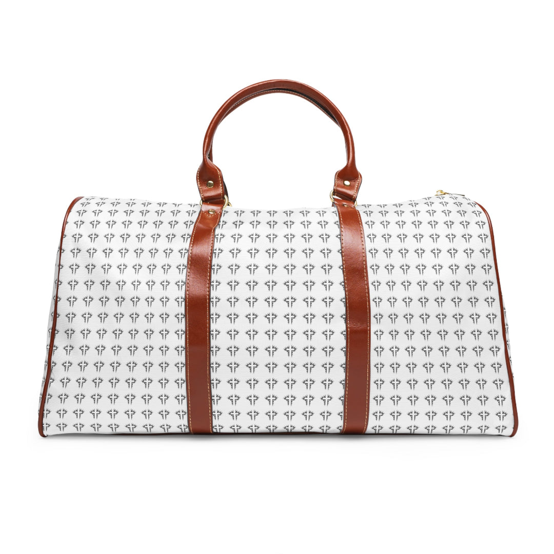 White Christian Cross travel bag with brown PU leather handles and gold zipper, featuring repeated cross pattern and durable nylon material.