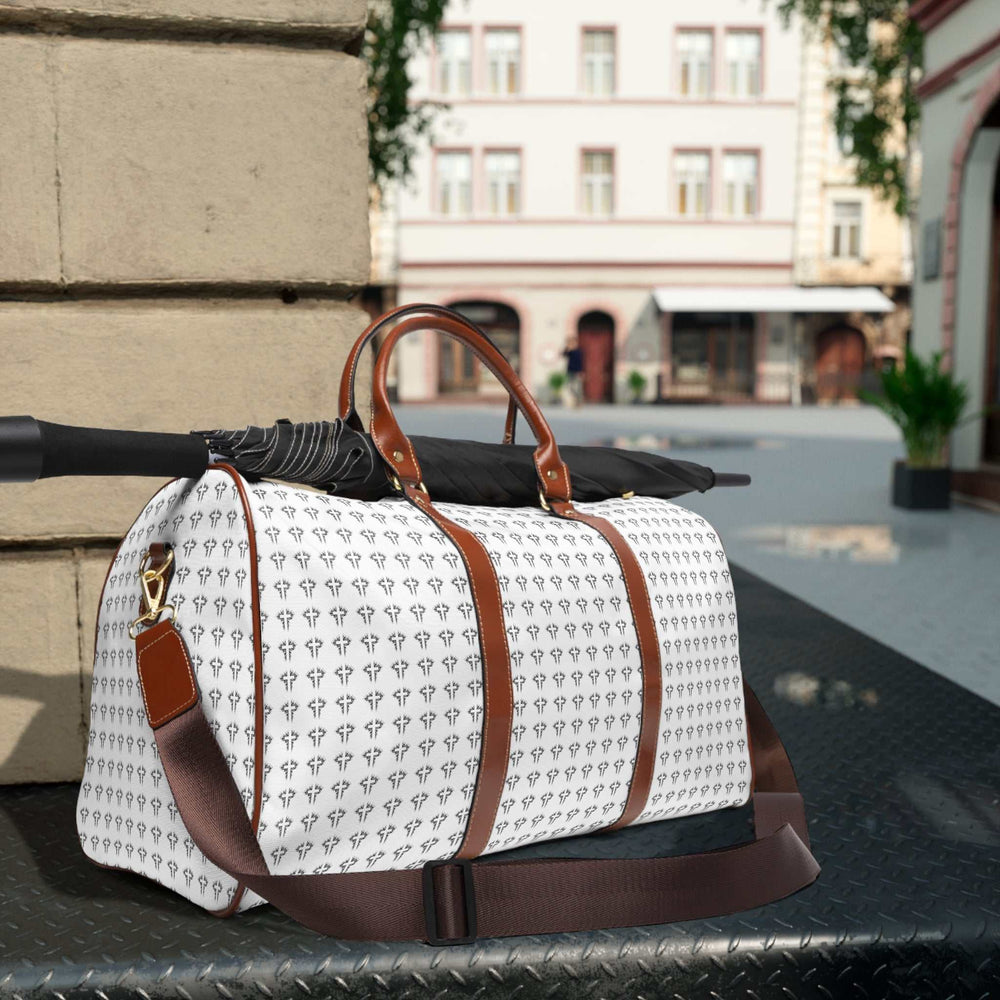 Christian Cross travel bag with brown PU leather handles, adjustable shoulder strap, and patterned white high-grade nylon body featuring cross design.