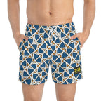 Close-up of male torso wearing swim trunks with geometric pattern