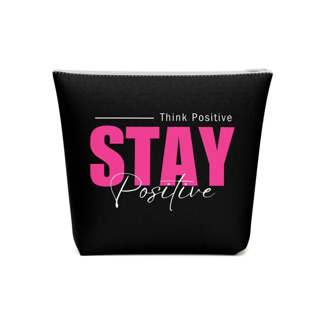 Cosmetic bag with "Stay Positive" pink and white text