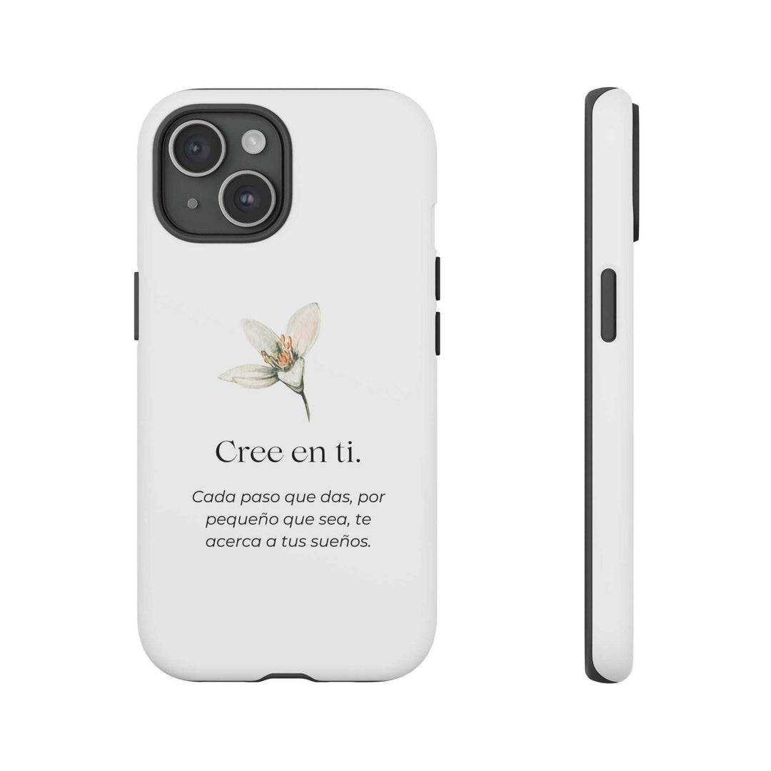 White matte Cree en Ti phone case with floral design and motivational Spanish text for self-belief and protection.