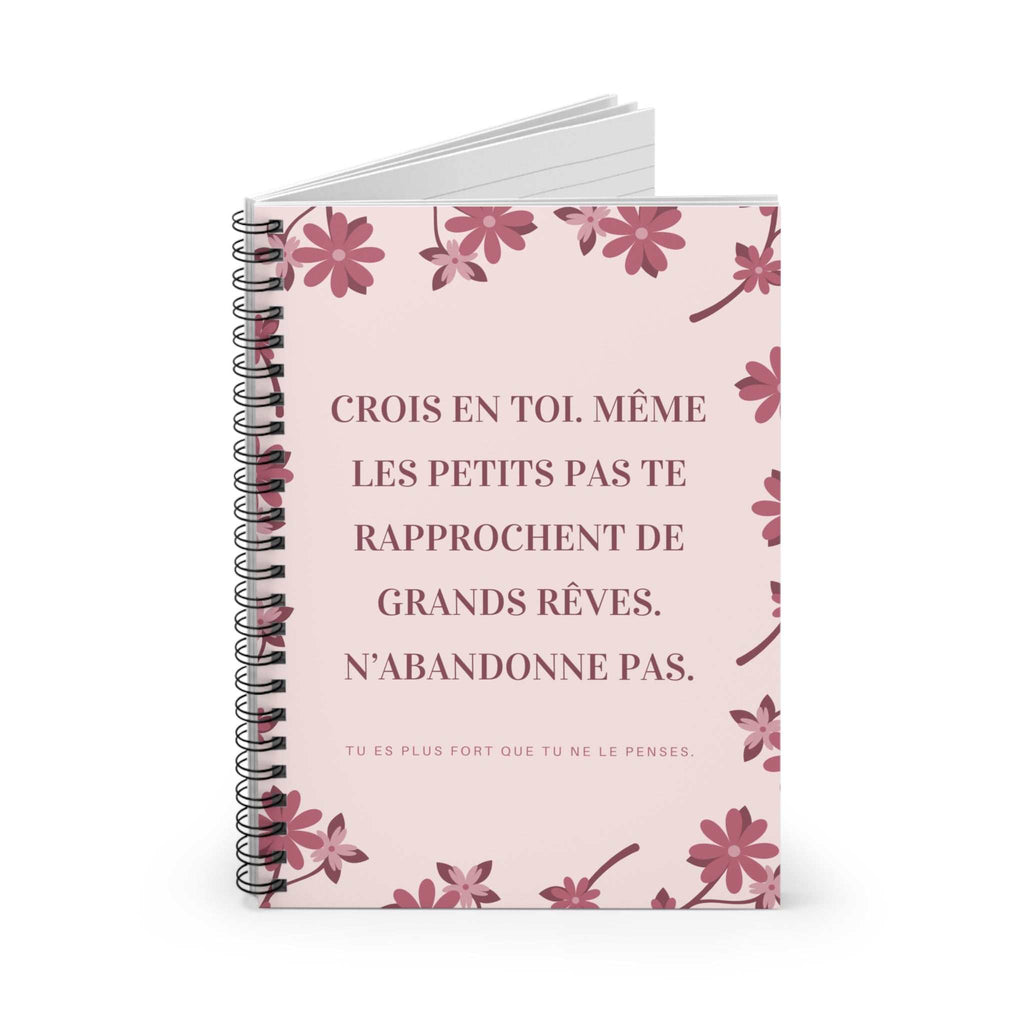 Spiral bound motivational notebook with pink floral front cover and lined pages