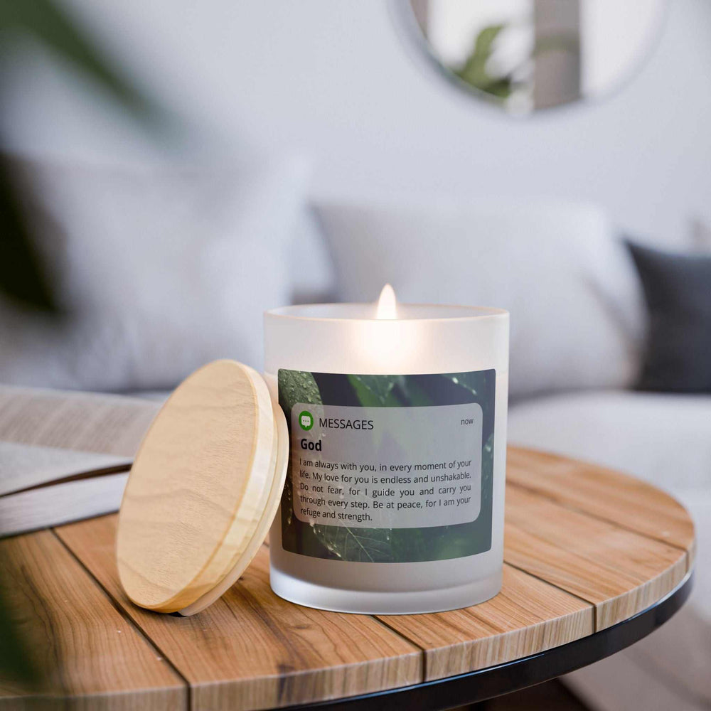 Divine Message glass candle with wooden wick, frosted glass and maple lid, filled with natural off-white coconut soy wax, lit on wooden tray.
