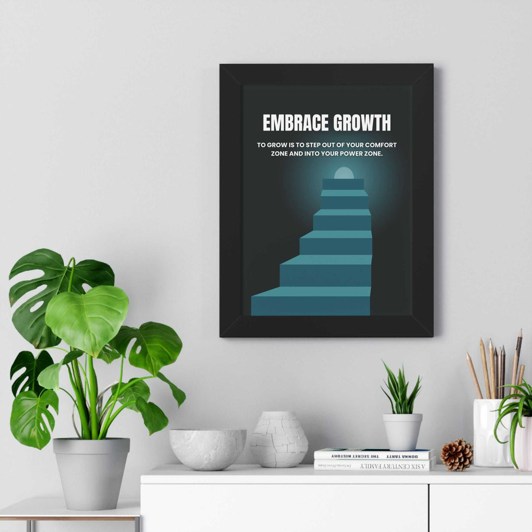 Framed Embrace Growth poster with stairs illustration and motivational quote, displayed above white shelf with plants and decor.