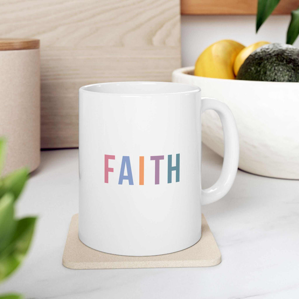 White ceramic mug with colorful "FAITH" text, 11oz capacity, comfortable C-handle, durable and BPA-free.