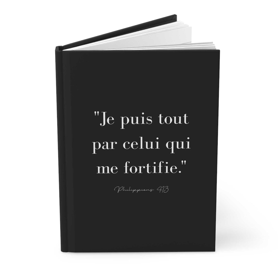 Black journal with French inspirational quote from Philippians 4:13 on the cover, full wraparound print, 150 lined pages, matte finish, casewrap binding.