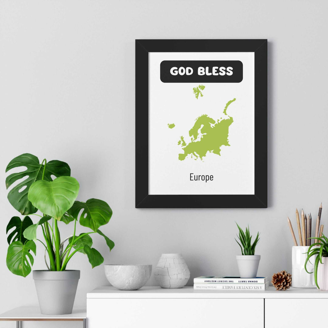God Bless Europe poster with green map design in black frame on wall above modern white shelf with plants and decor