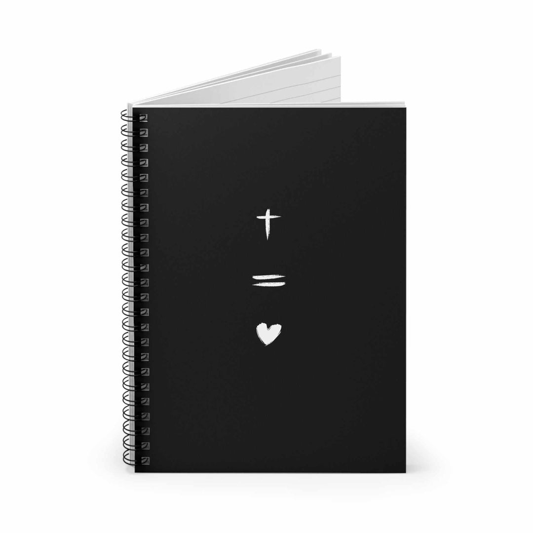 Black spiral-bound notebook with a cross, equals sign, and heart symbol on the front cover