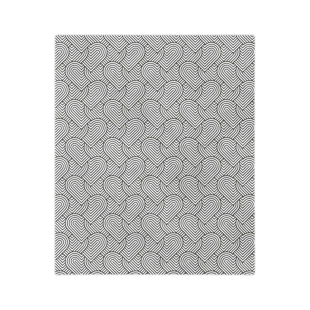 Graphic hearts blanket with black and white geometric heart design