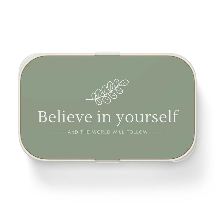 Green bento lunch box with "Believe in yourself" text
