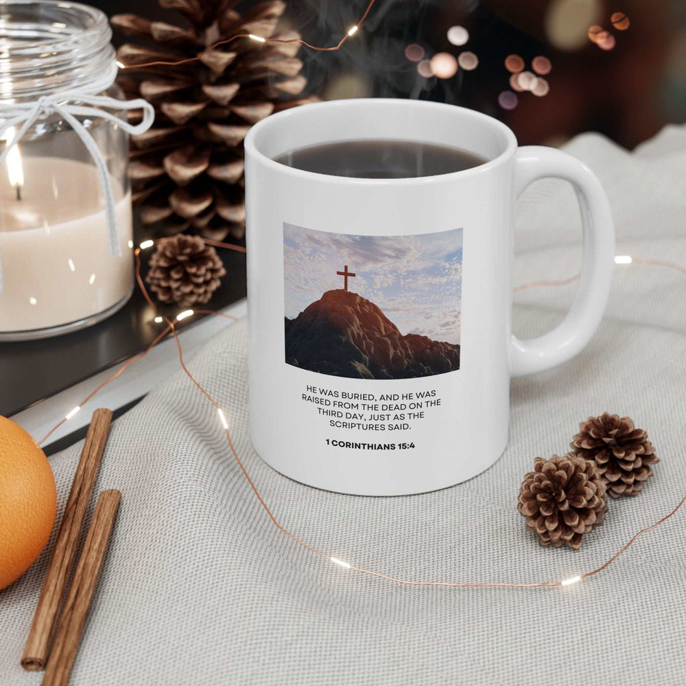 White ceramic mug with a cross on a hill design and 1 Corinthians 15:4 Bible verse, 11oz inspirational coffee mug