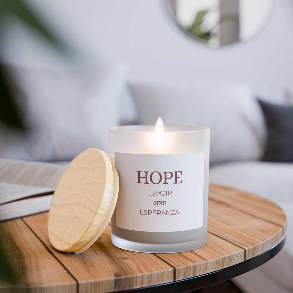 Hope Glass Candle with coconut soy wax, wooden wick, frosted glass vessel, and raw maple lid, 50-hour burn time.