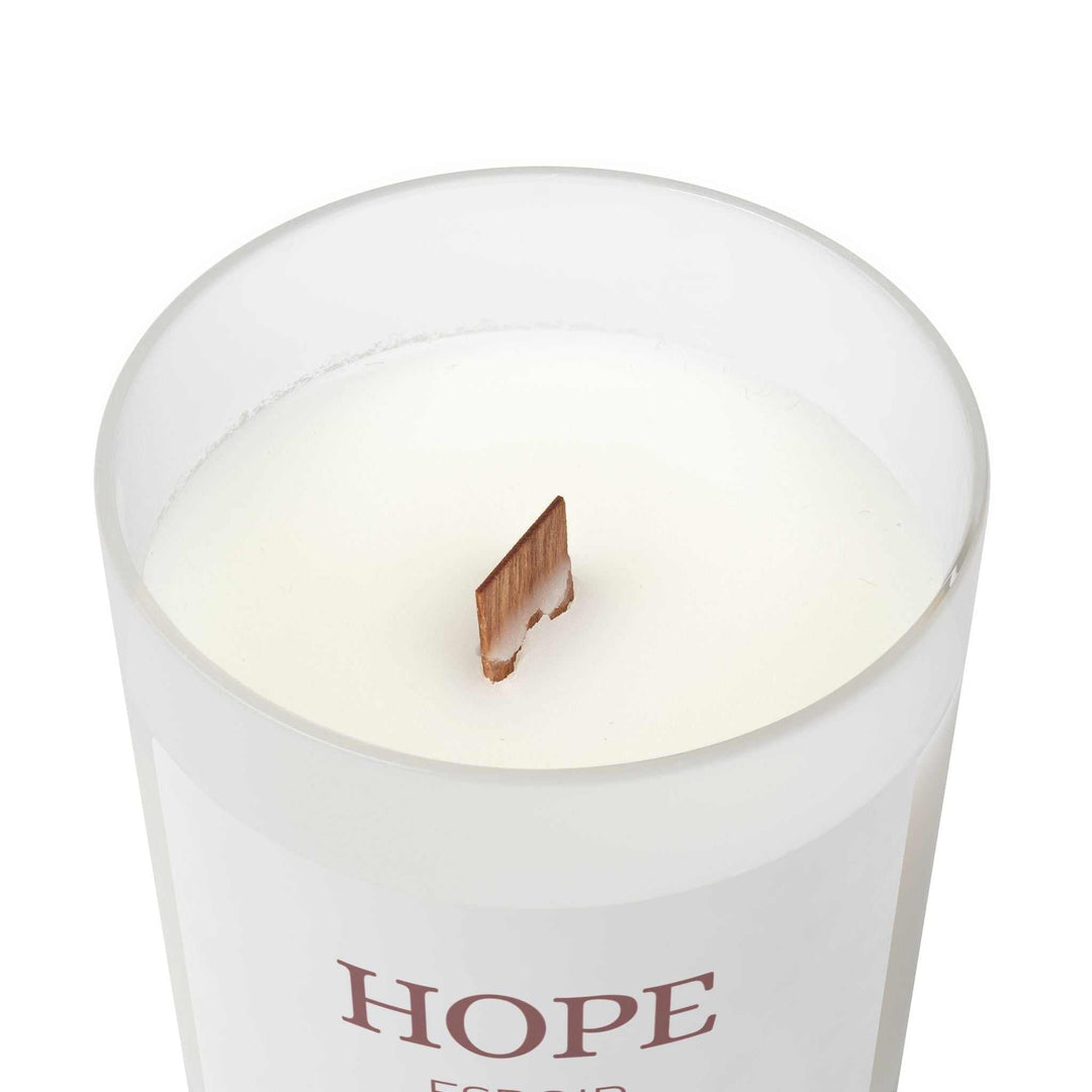Natural off-white Hope Glass Candle with coconut soy wax and unique wooden wick in frosted glass vessel with raw maple lid.