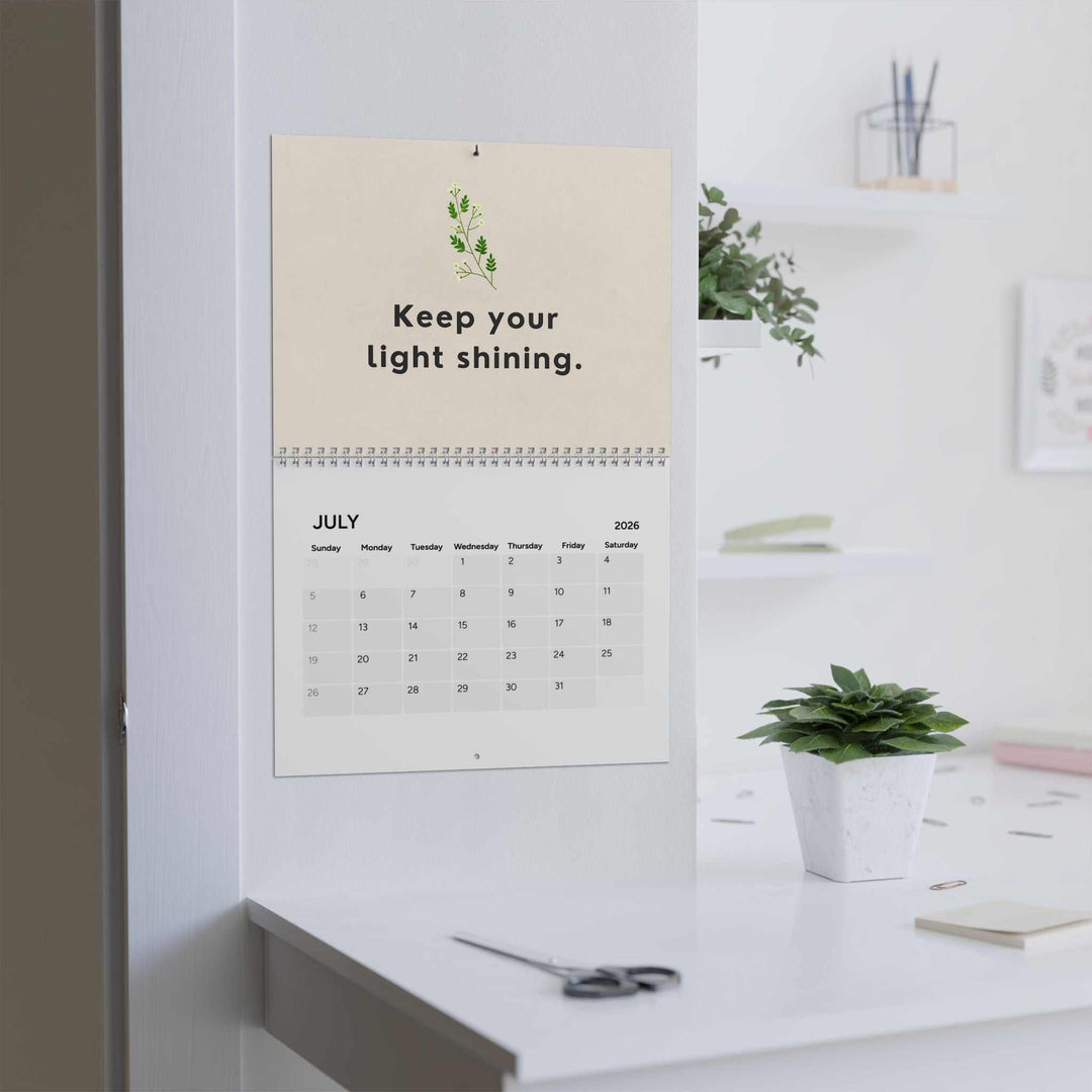 Inspirational Calendar 2026 hanging on wall with motivational quote