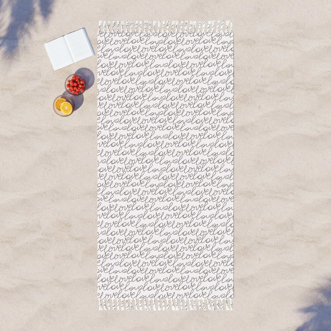 Large Love Beach Cloth with repeated script pattern on sand