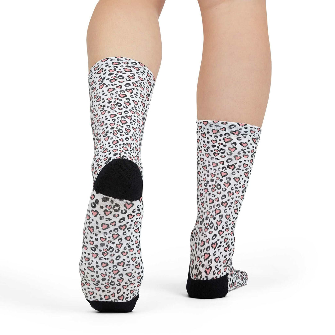 Leopard Hearts Socks with black heel and toe accents on feet