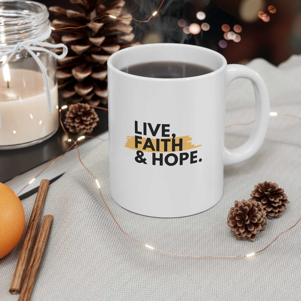 White ceramic mug with "Live, Faith & Hope" text and glossy finish filled with coffee