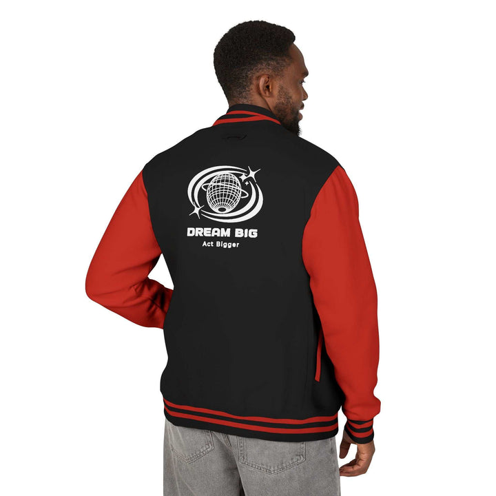 Man wearing black and red Dream Big jacket with graphic and text on back