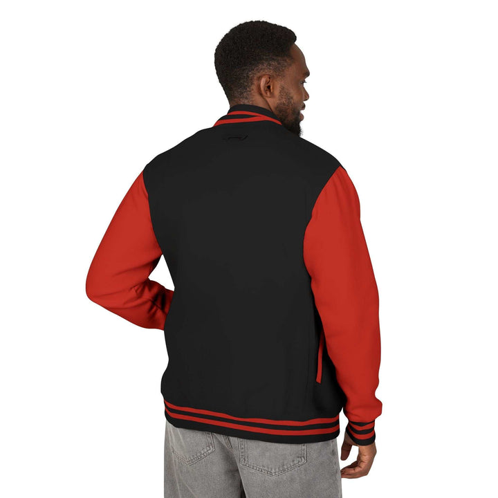 Back view of a man wearing a black and red Never Give Up jacket with striped cuffs and waistband