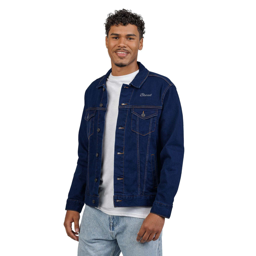 Man wearing a dark blue Blessed Denim Jacket with chest pockets and button details over a white t-shirt and light blue jeans
