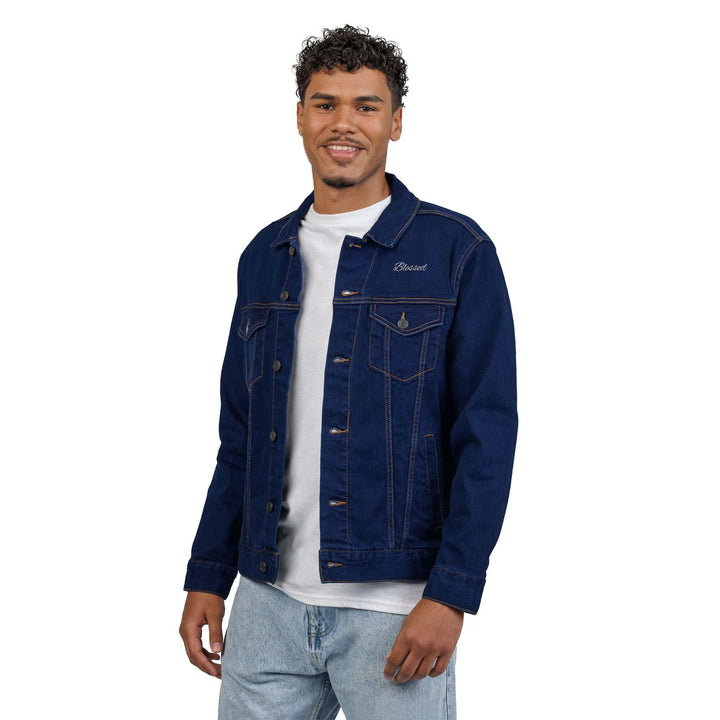 Man wearing a dark blue Blessed Denim Jacket with chest pockets and button details over a white t-shirt and light blue jeans