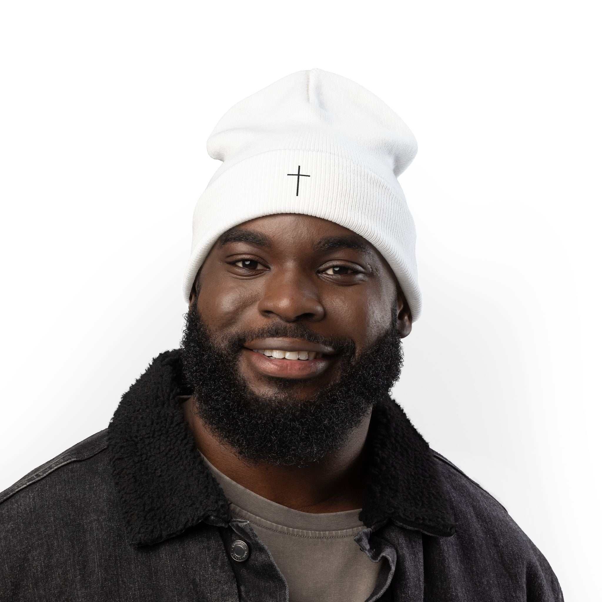 Man wearing a white Faith Knit Beanie with a small embroidered cross