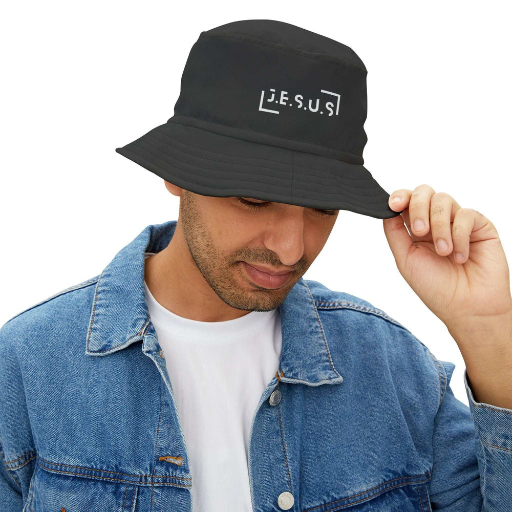 Black Jesus bucket hat made of 100% polyester, available in three sizes, worn with denim jacket.