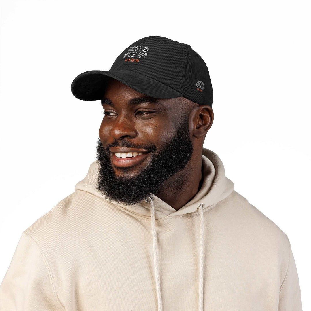 Man wearing black Never Give Up Cap vintage