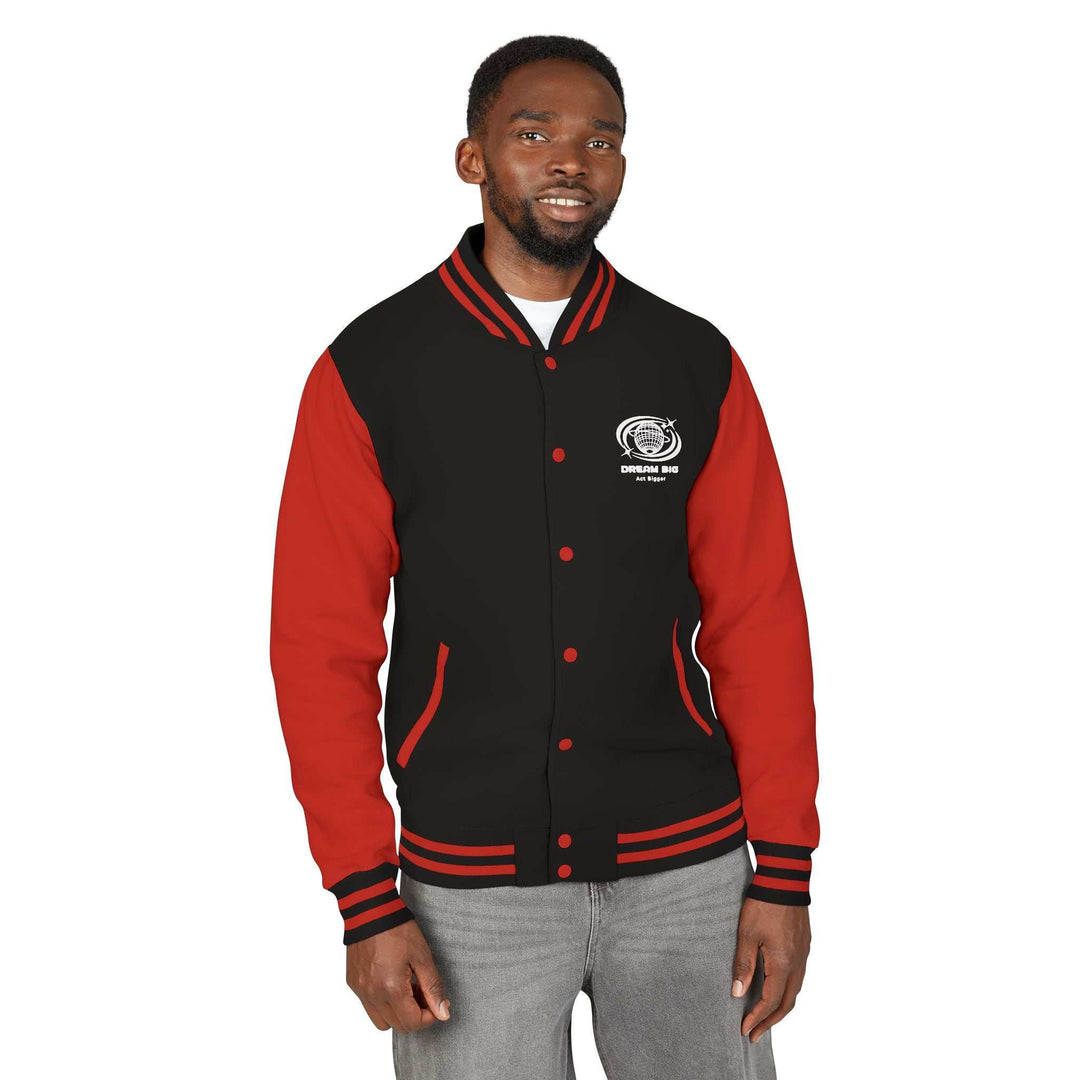 Man wearing black and red Dream Big jacket with embroidered logo on chest and striped cuffs and collar