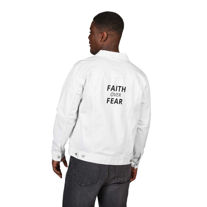 Man wearing white denim jacket with "FAITH OVER FEAR" text on back, paired with dark jeans