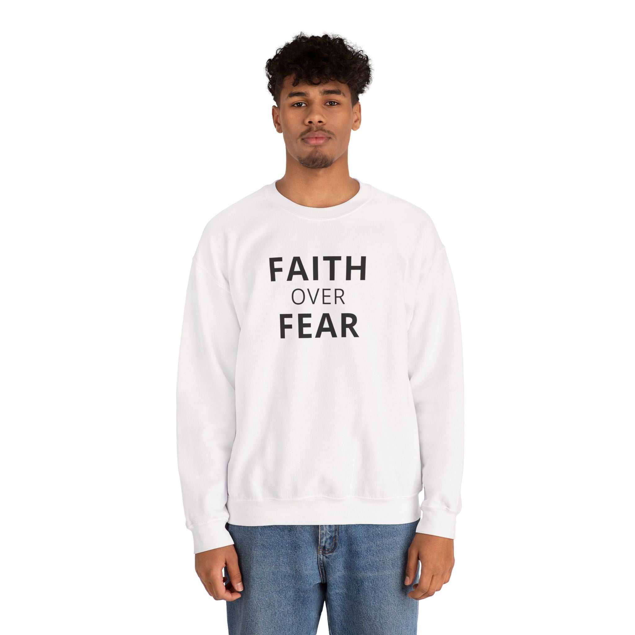 Man wearing white Faith Over Fear sweatshirt with bold text, classic fit, cotton-polyester blend