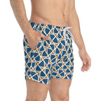 Men's ethnic swim trunks with blue, white, and orange geometric pattern