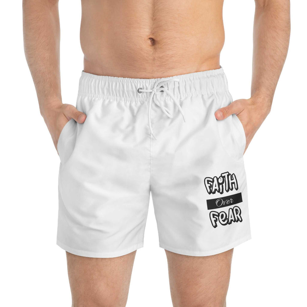Men's white Faith Over Fear Swim Trunks with drawstring waist