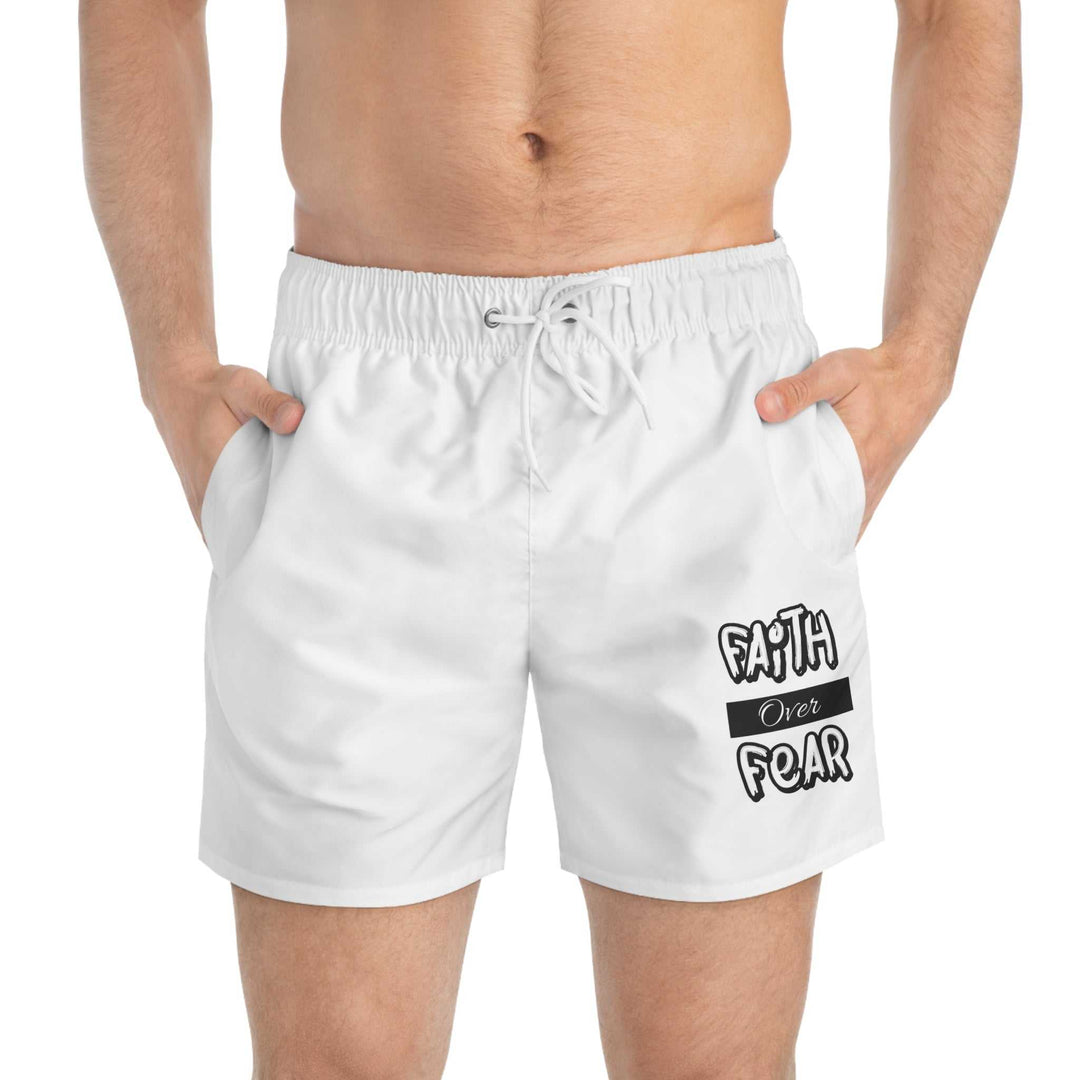 Men's white Faith Over Fear Swim Trunks with drawstring waist