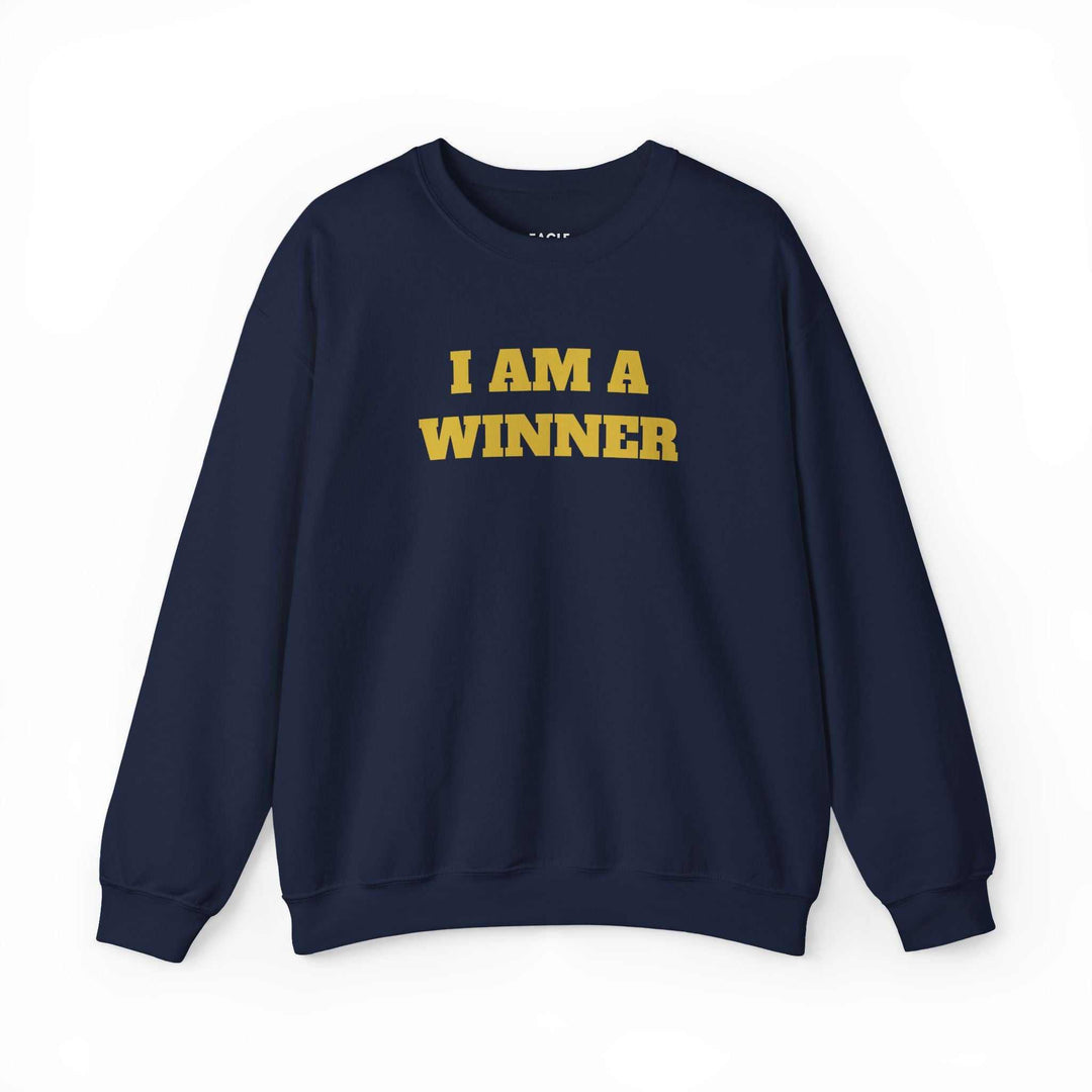 Navy winner mindset sweatshirt with "I AM A WINNER" text in bold yellow, classic fit cotton-poly blend