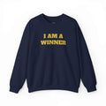Navy blue sweatshirt with "I AM A WINNER" text in bold yellow, classic fit cotton-poly blend