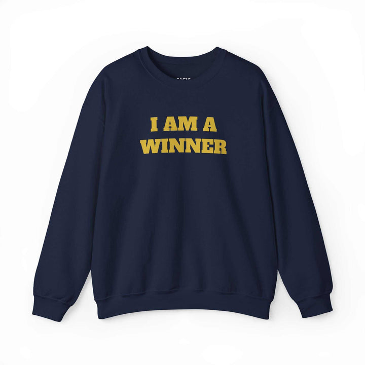 Navy winner mindset sweatshirt with "I AM A WINNER" text in bold yellow, classic fit cotton-poly blend