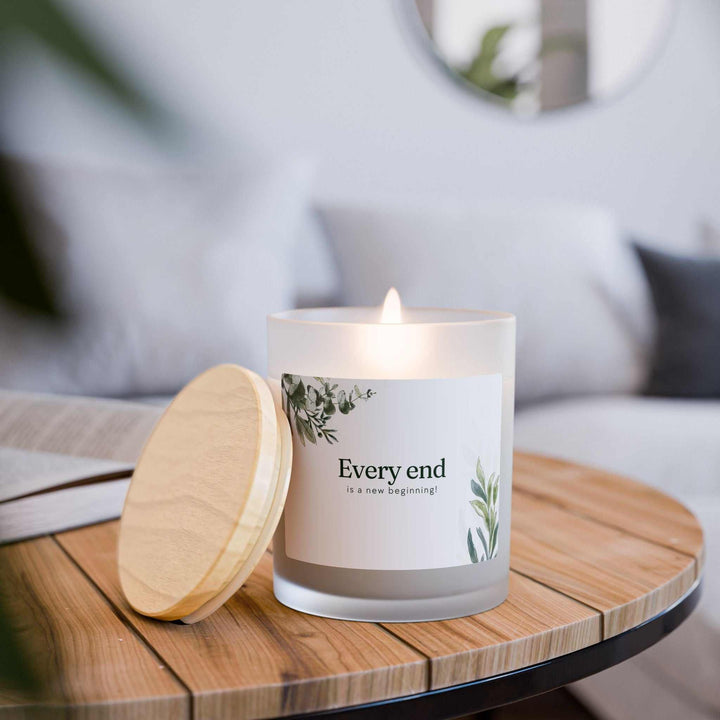 New Beginnings Glass Candle with wooden wick in frosted glass and raw maple lid, natural off-white coconut soy wax, 50-hour burn time.