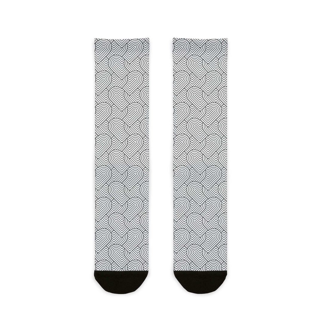 Pair of geometric heart socks with black heel and toe accents