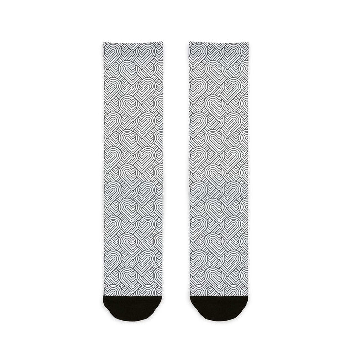Pair of geometric heart socks with black heel and toe accents