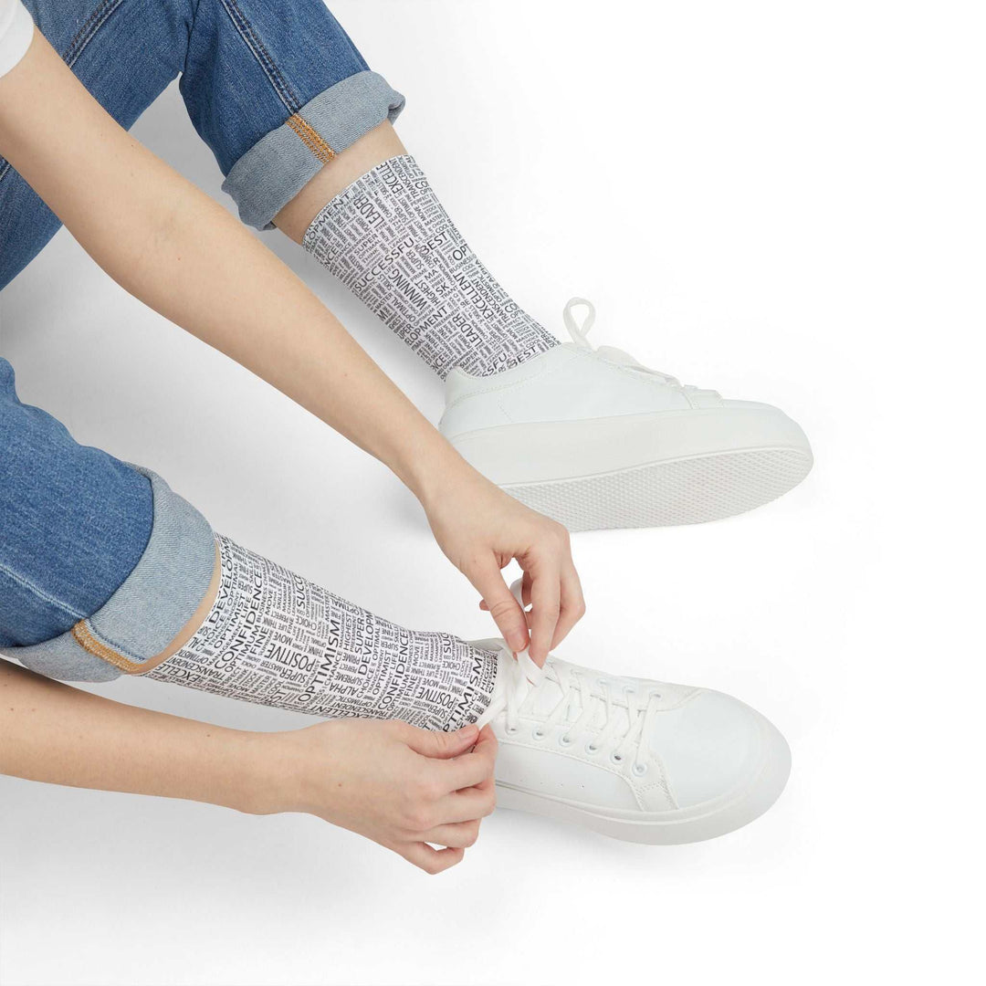 Person wearing Positive Words Socks with positive text design