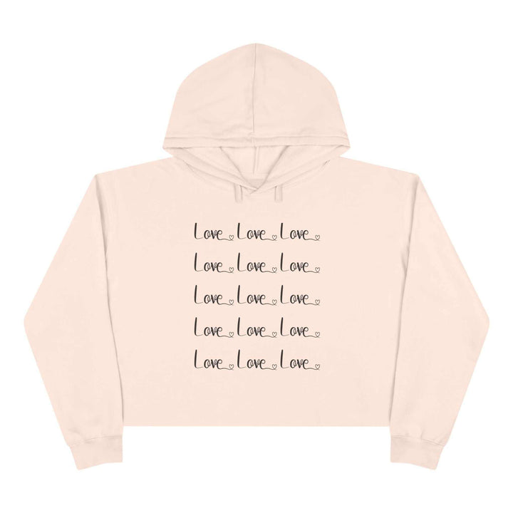 Pink Love Crop Hoodie with repeated black "Love" text design