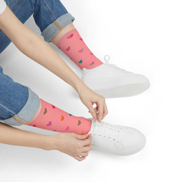 Pink crew socks with black heel and toe accents