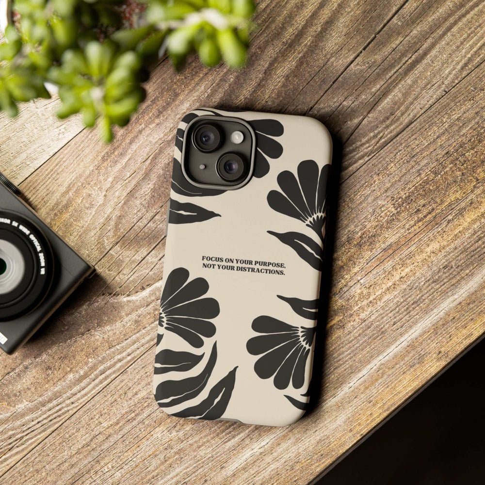 Purpose Over Distraction phone case with black floral design on matte beige background, motivational text, durable dual-layer protection.