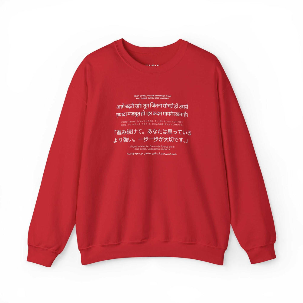 Red Keep Going sweatshirt with motivational text in multiple languages, classic fit, made of cotton and polyester blend