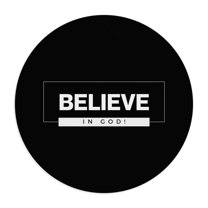Round black mouse pad with bold white text saying "BELIEVE IN GOD!" for a faith-inspired workspace accessory.